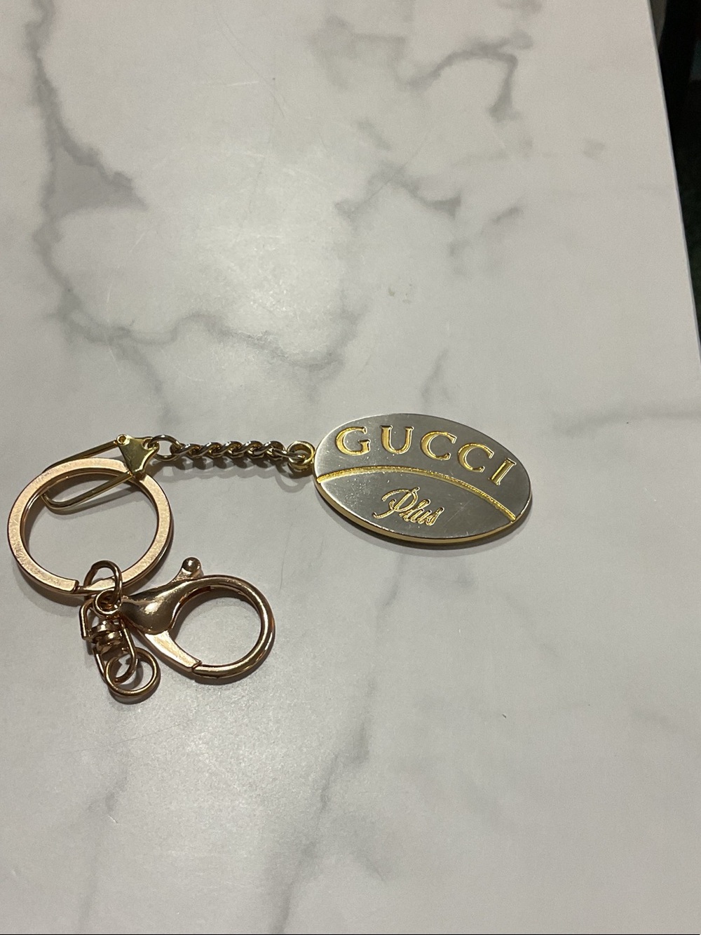 GUCCI Gold and Silver Oval Logo Keyring
